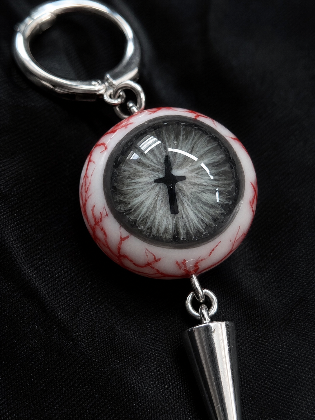 Cross Pupil Spike Earrings - 04_earring_macro_detail.png