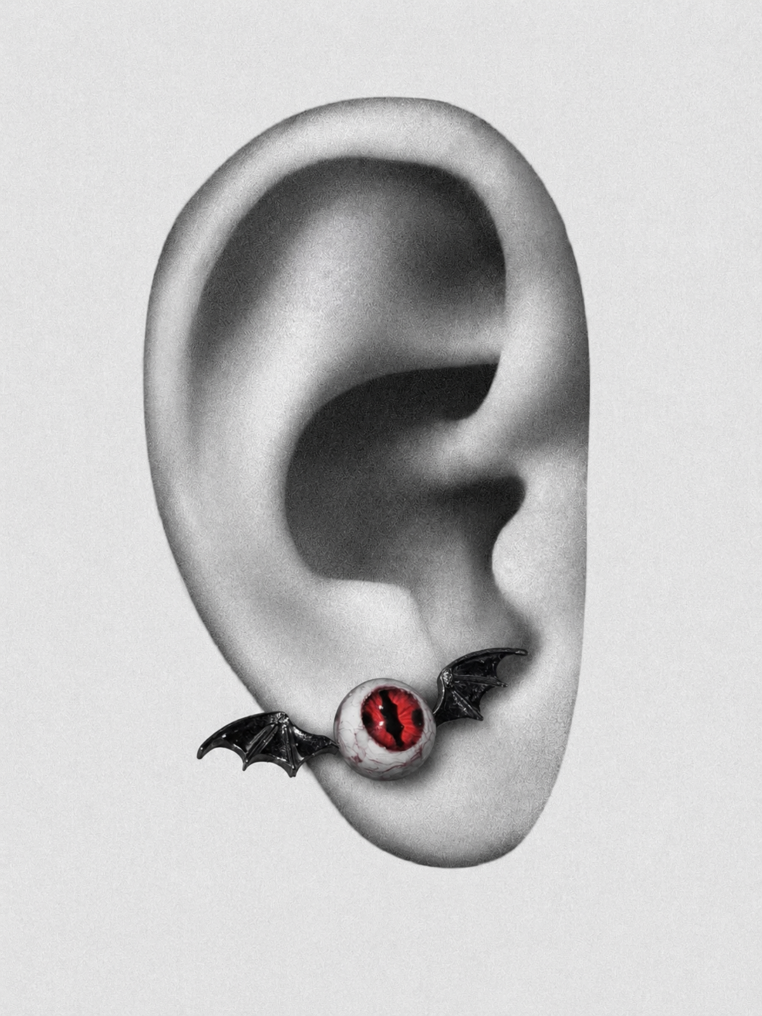 Bat wing eye ear cuff on monochrome ear